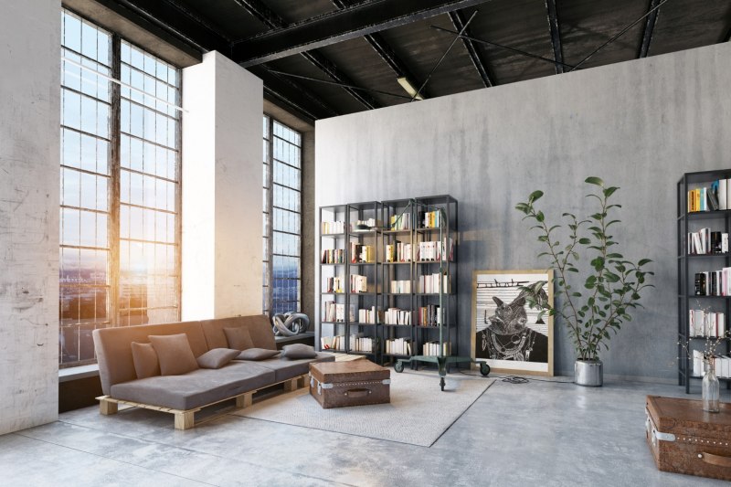 salon w stylu industrialnym z betonową podłogą i ścianami